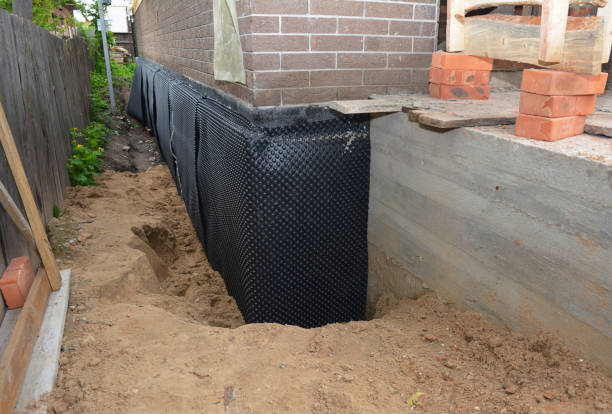 Happy homeowners after waterproofing job in Gaines